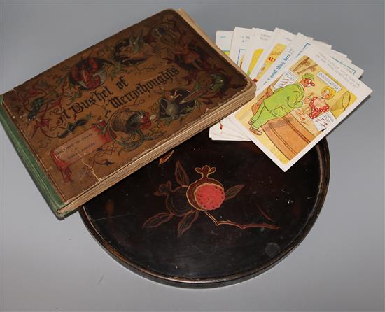 A collection of 1950s humorous postcards and a Victorian childrens book